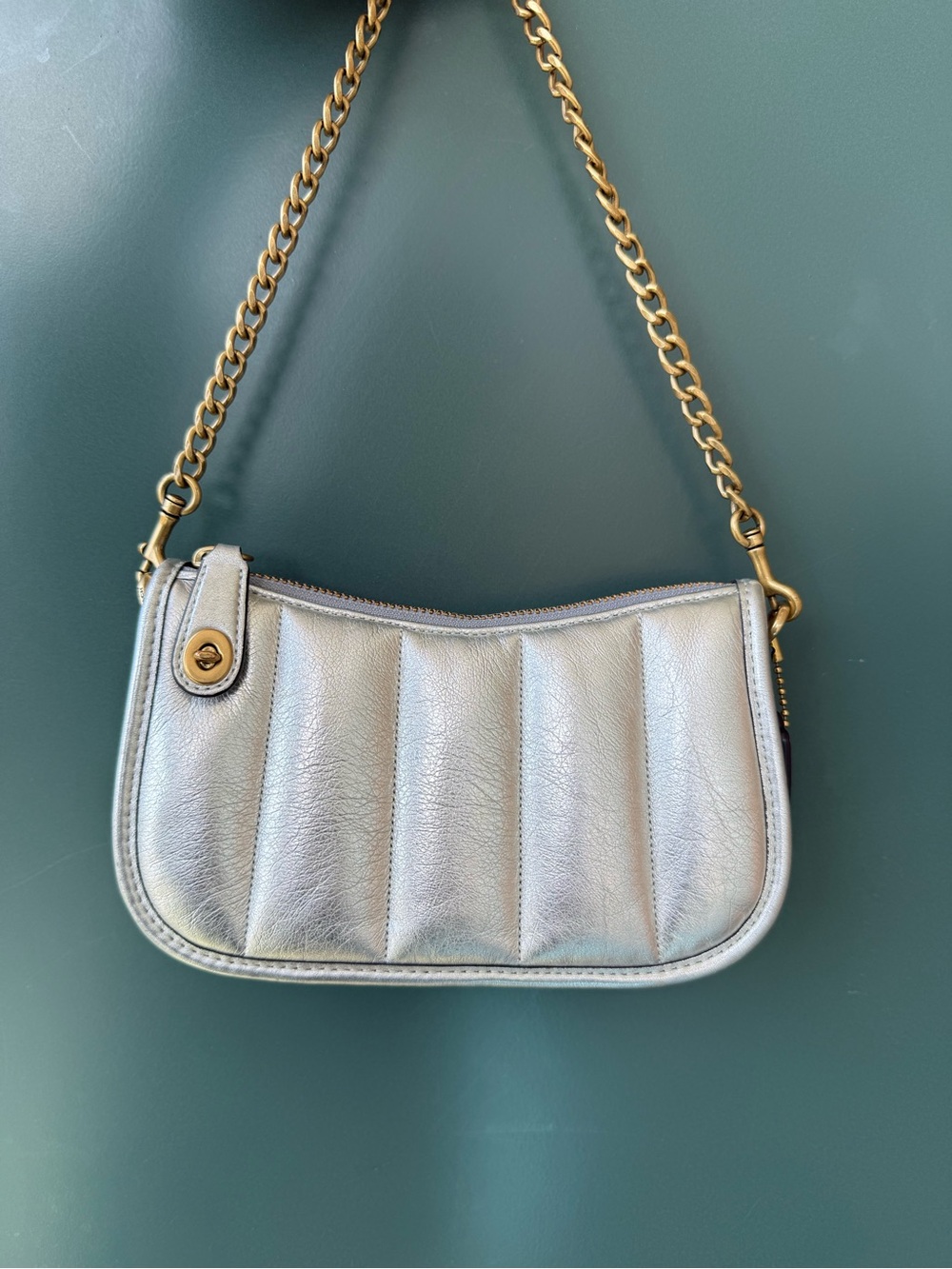 Coach swinger 20 metallic leather clutch